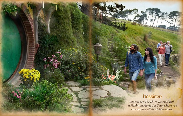 A white couple heads into a hobbit hole in a tourism brochure