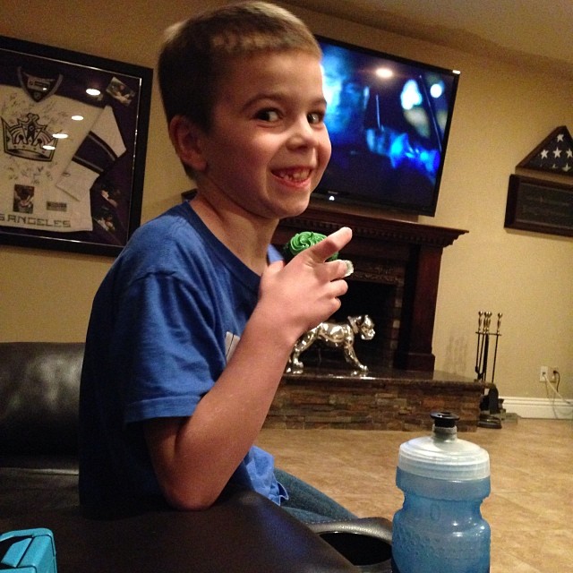 My kid looks like he is up to no good eating a cupcake tonight. Apparently he had 5 of the Superbowl cupcakes that I made. He never eats sweets like this. #superbowl14 #cupcakes