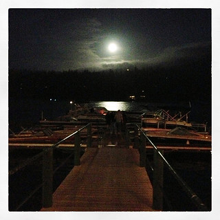 full moon on the lake at the docks