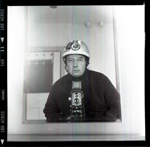 reflected self-portrait with Halma Flex camera and hard hat by pho-Tony