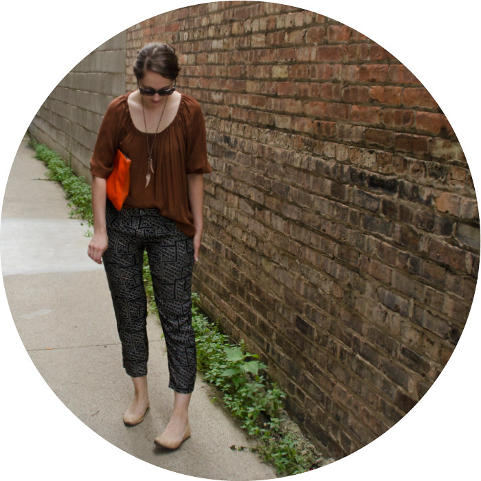 rust, print pants with blouse top, what to wear to work, navy and rust, orange clutch, talon necklace, joie silk top