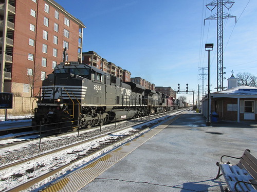 A northbound Norfolk Southern Railroad freight train passes through the Morton Grove Metra commuter rail station.  Morton Grove Illinois.  Thursday, December 12th, 2013. by Eddie from Chicago
