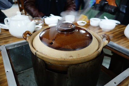 Can you see the steam escaping from the claypot's lid?