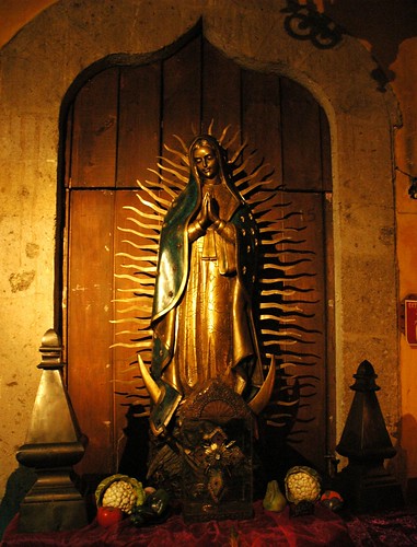Our Lady of Guadalupe, statue with flaming halo, standing on a moon, The fountain of the archangel Saint Michael, La Fonda de San Miguel Arcangel, formerly El Convento de Santa Teresa de Jesus by Wonderlane