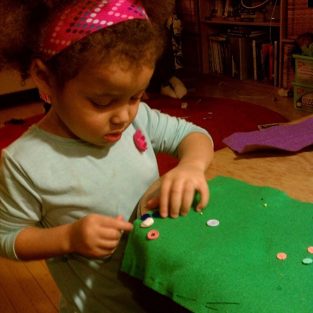 Learning to sew on buttons. #mytoddlersews #isew