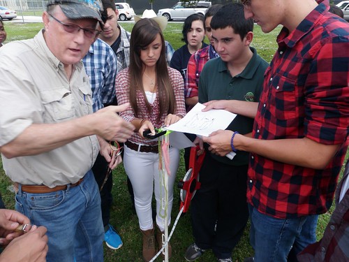 Greg Garvey, with NRCS Florida, works with TERRA students to prepare a transect for field data collection activities. Photo by: Yolanda Rivera, NRCS Florida.