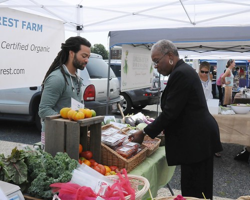 Administrator Rowe views the healthy offerings provided at a local farmers market.