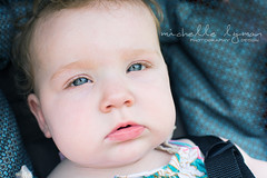 Close up of blue eyed baby looking at viewer