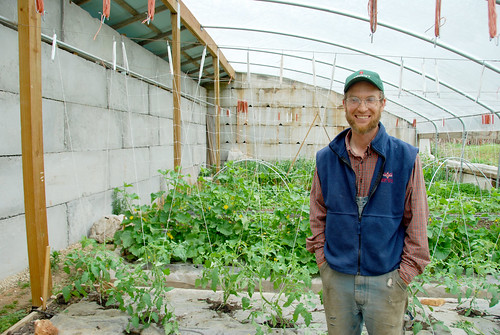 Curtis Millsap works in the Chinese High Tunnel on his southwestern Missouri farm. NRCS photo.