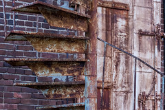 Rusted Spiral Staircase and Door