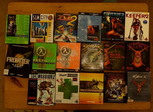 a big pile of computer game boxes