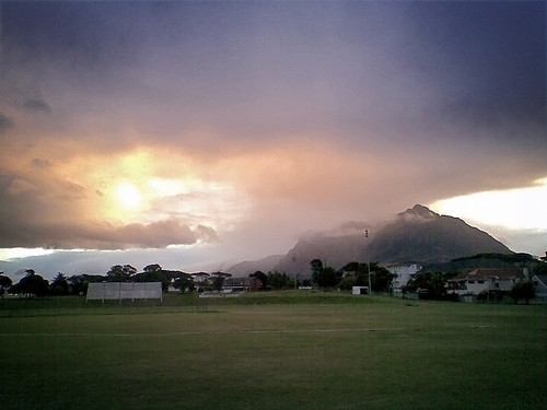 city houses winter light sunset summer cloud dog sun white house hot green field weather pinetree pine clouds walking gold golden evening twilight glow moody cloudy dusk walk suburbia peak overcast capetown calm line cricket neighborhood pierce glowing pinelands suburb worldcup activity markings clubhouse tablemountain humid 2010 devilspeak sportsfield theoval mountainrange constantia soccerworldcup worldcup2010 pinelandsgardencity fifa2010
