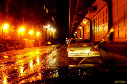 road door orange wet water car rain yellow night dark geotagged puddle lights alley glare garage huntington wv transportation vehicle thumbsup aw huntingtonwv rcvernors