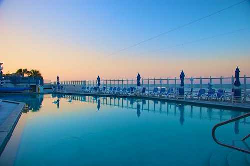 ocean sunset sky pool twilight chairs florida resort deck umbrellas newsmyrnabeach islanderbeachresort