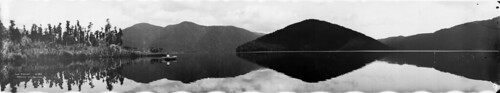 newzealand lake mountains nature water reflections landscape boat scenic panoramic symmetry mirrorimage westland lakeparinga nationallibrarynz robertpercymoore commons:event=commonground2009