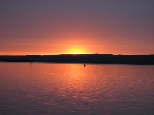 red sky sun dan water sunrise river buoy