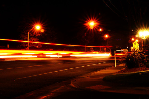 road street light red orange ahead sign yellow night lights utah long exposure desert crosswalk