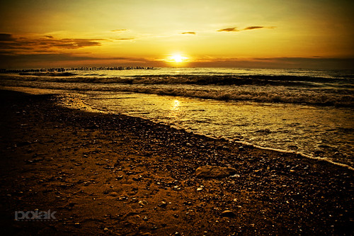sunset sea summer sky sun reflection clouds landscape gold golden rocks waves poland mielno