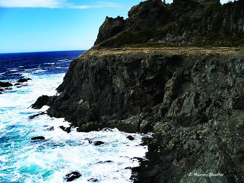 ocean mountain beach newfoundland photography waves cliffs