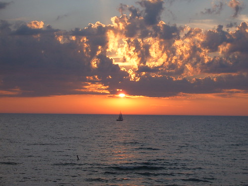 sunset sun beach sailboat peace cloudy michigan tranquility lakemichigan lakeshore southhaven endofsummer justonelook southhavenmi beautyintheeyeofthebeholder outsidethecity absolutelystunningscapes planetearthourhome reallycoolphotos