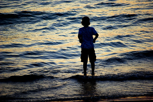 blue boy sunset lakemichigan wading ovalbeach