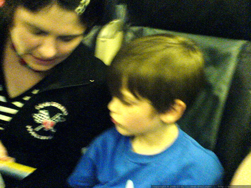 rachel and nick in the row behind us   playing go fish?   DSC01281