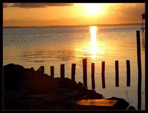 light shadow vacation beach water sunrise reflections ripple alabama pilings gulfshores fortmorgan bonsecourbay