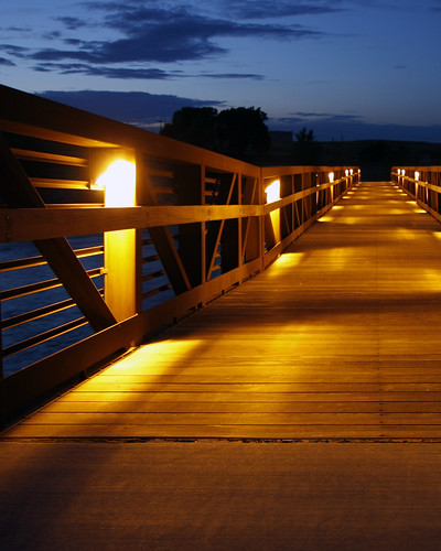 bridge night river lights dusk boardwalk