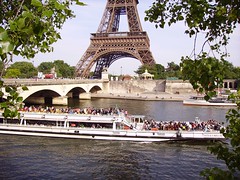 Bateau Mouche on river Seine near the Pont d'Iéna and Eiffel Tower in Paris, France