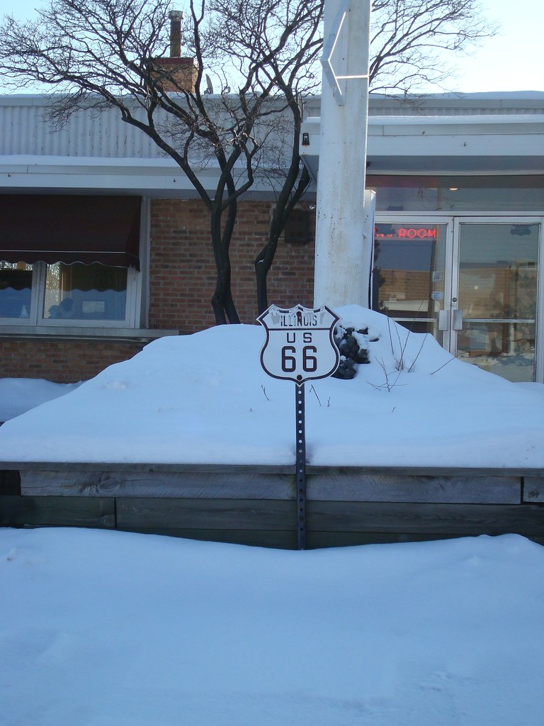 This U.S. Route 66 sign is posted in front of the Dell Rhea Chicken Basket in Willowbrook, IL.