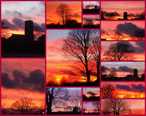 blue trees houses sunset red sky orange church wales clouds pembrokeshire lamphey