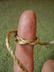 Finger with string: Some rights reserved by mwoodard/Flickr