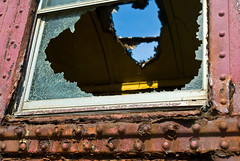 Broken glass and roof of abandoned train