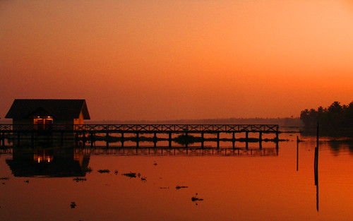 sunset india reflection floating kerala cottages cherthala