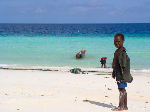 africa boy beach tanzania island indianocean zanzibar archipelago spiceisland whitesandbeach eastafrica nungwi unguja rasnungwi