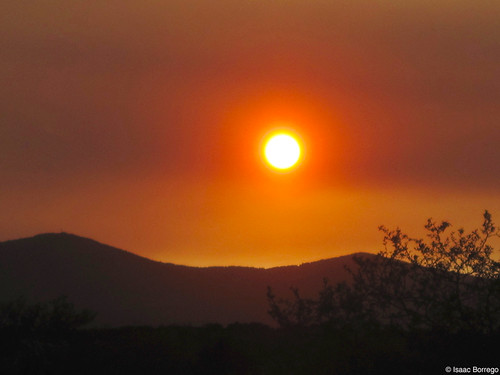 sun sunset settingsun light mountains silhouette newmexico nm whiterock losalamos fire red smoke haze june 2011 canon eos rebel xsi unitedstates america