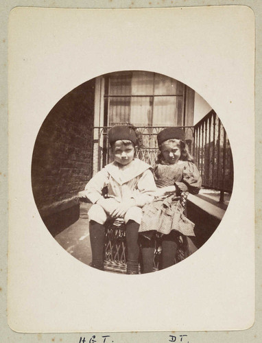 Two children on a balcony