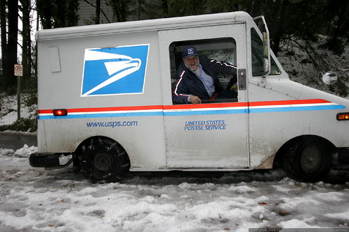 our neighborhood postman, literally following the snowplow up the hill to catch up on a lot of undelivered mail    MG 4551
