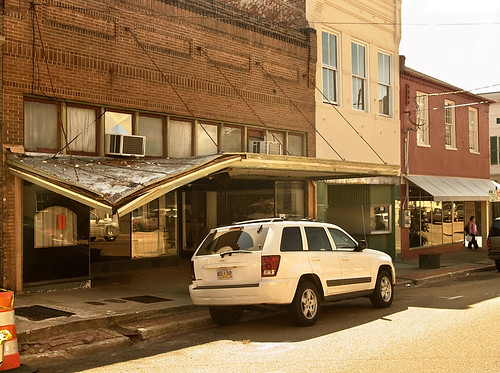 street old roof usa building history window shop stone mississippi marquee office downtown unitedstates pavement decay district south entrance style landmark historic business southern sidewalk porch collapse natchez canopy decline disrepair deepsouth deterioate