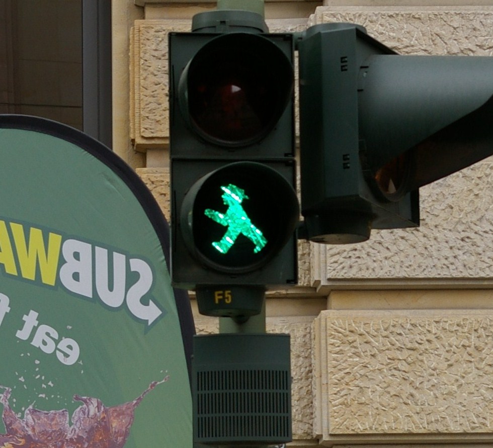 green man in a go light for pedestrians