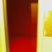 Yellow elevator stopping on the red floor.