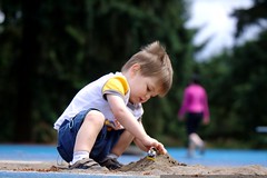burying his digger in the long jump pit while mom wa… 