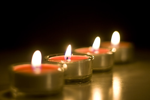 light red four fire candle dof flame selectivefocus