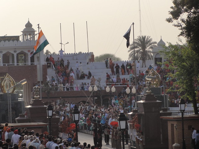 security personnel lowering the flag of their respective countries at Wagah Border 