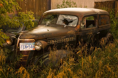 old abandoned broken glass grass car landscape rust rusty headlights chevy chrome modified weathered decrepit decaying dilapidated masterdeluxe