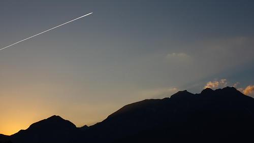 sunset sky sun mountains silhouette clouds canon airplane austria aeroplane 1855 innsbruck vaportrail 450d
