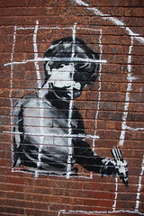 Banksy in Boston: Detail of the NO LOITRIN piece on Essex St in Central Square, Cambridge