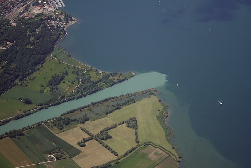 italy travel cessna flying aviation aerial panorama landscape above sky view skyview airplane aeronautic high town city rooftop birdeye top fromabove water coastline nature earth h2o blue green lagodicomo lake como adda river valtellina lombardia lombardy