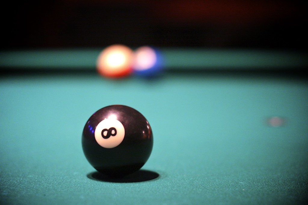 behind the eight ball