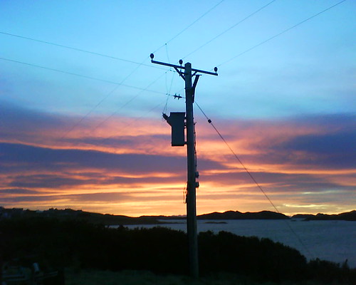 morning pink blue sea sky orange lines yellow clouds sunrise bluesky hills electricitypole lochcrossbost